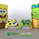 A photo of two limited edition Nickelodeon All-Stars Xbox Series X consoles featuring SpongeBob and Leo from TMNT.